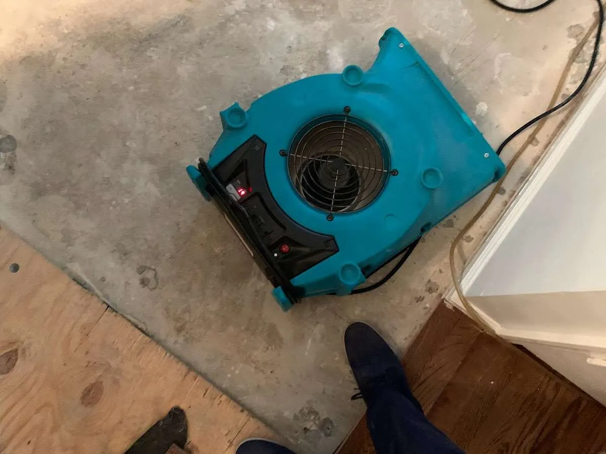 Air mover drying subfloor during Commercial Water Damage Restoration in Nevada